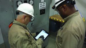 Exelon nuclear plant workers reviewing an eWP. 