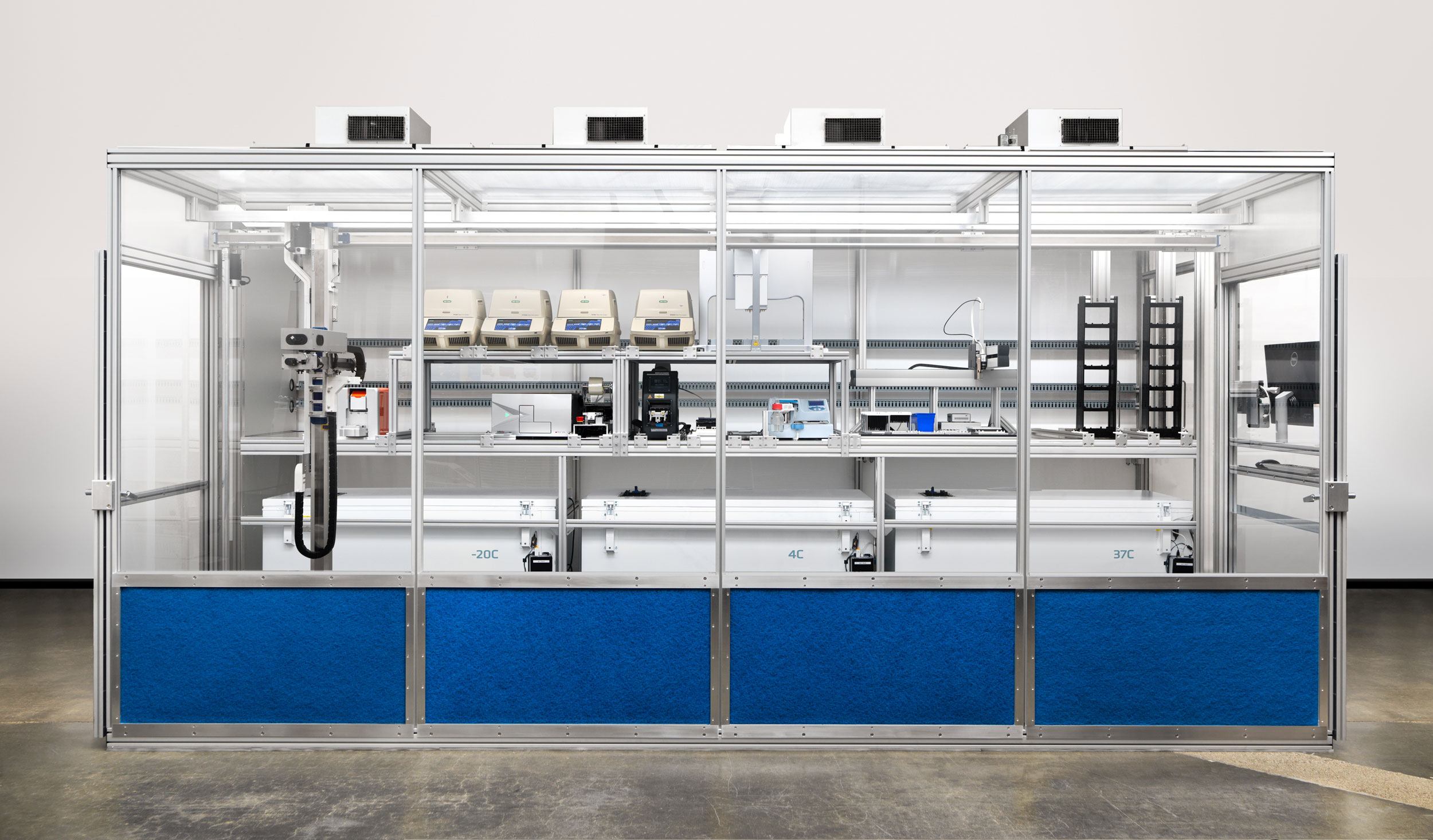 A typical Transcriptic workcell, featuring robotic arms and automated machines to complete lab processes.