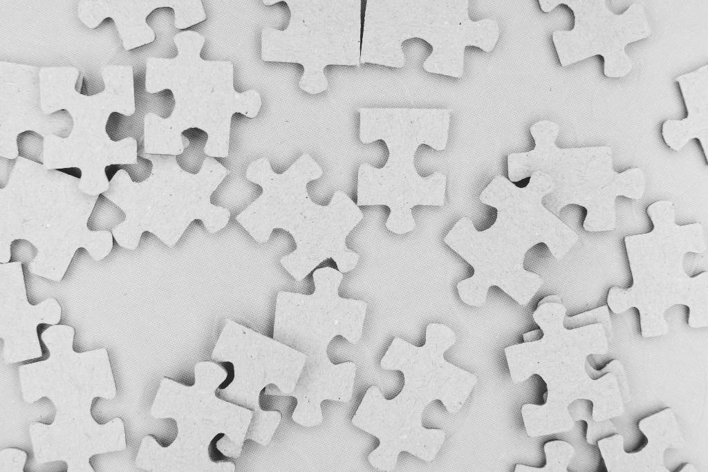 Gray scattered puzzle pieces.